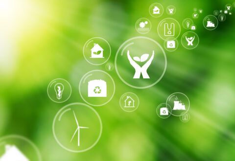 Kiertotalouden kuvakkeita vihreällä taustalla