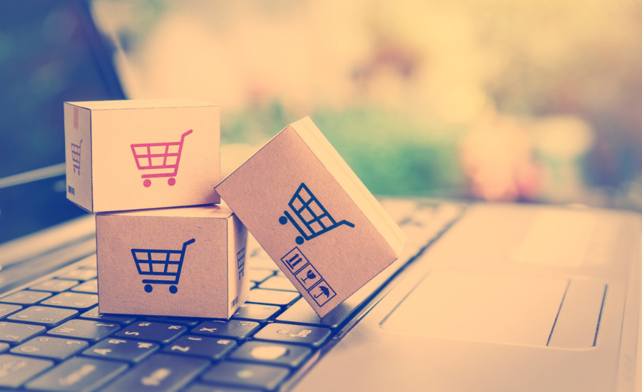 pahvilaatikoita, joissa ostoskärryn kuva